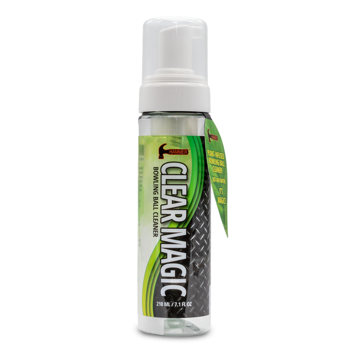 A seven fluid ounce pump spray clear bottle with a green and black label with "Clear Magic" and other information printed on it.
