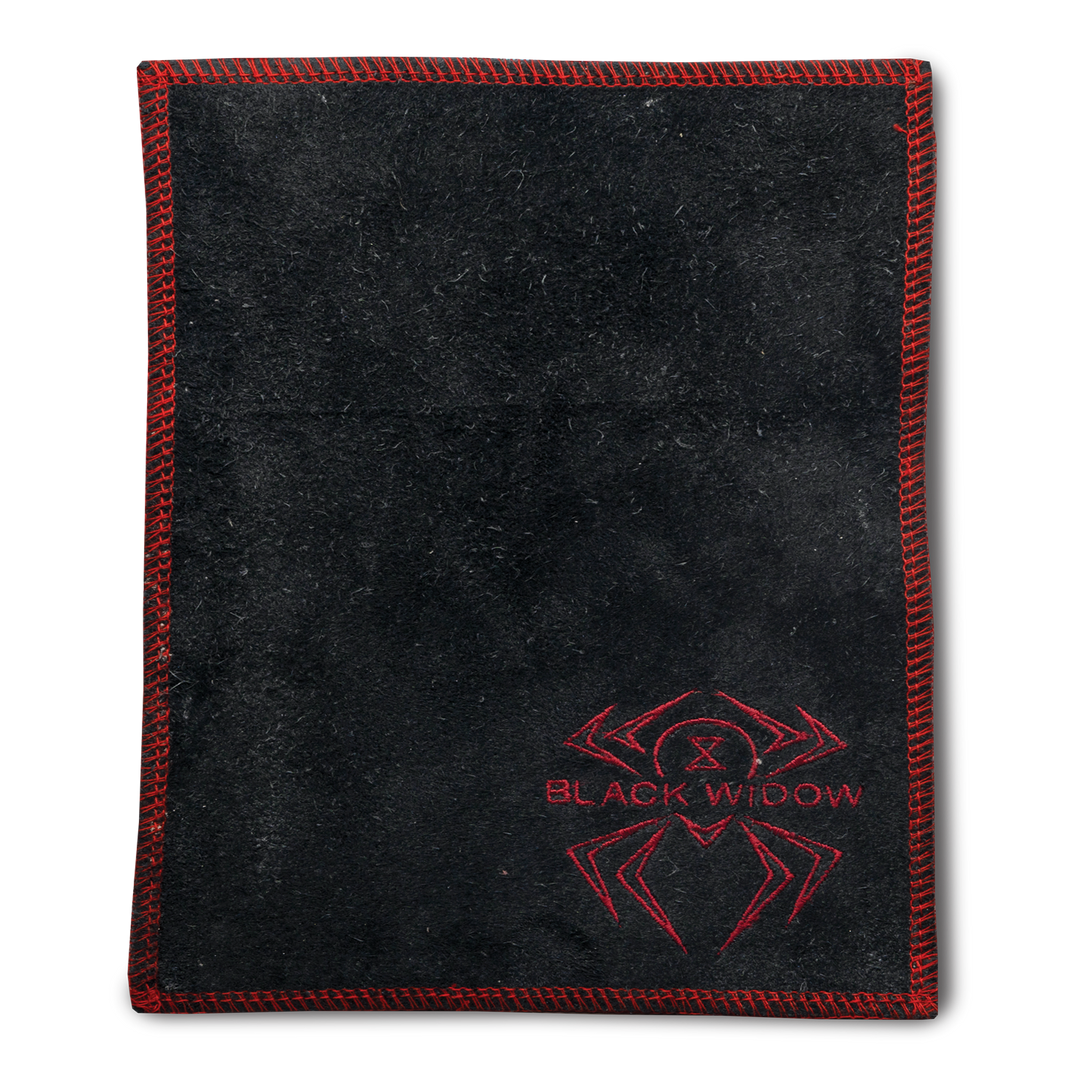 A black shammy pad with red stitching around all edges and the Black Widow logo embroidered in red in the lower right corner.