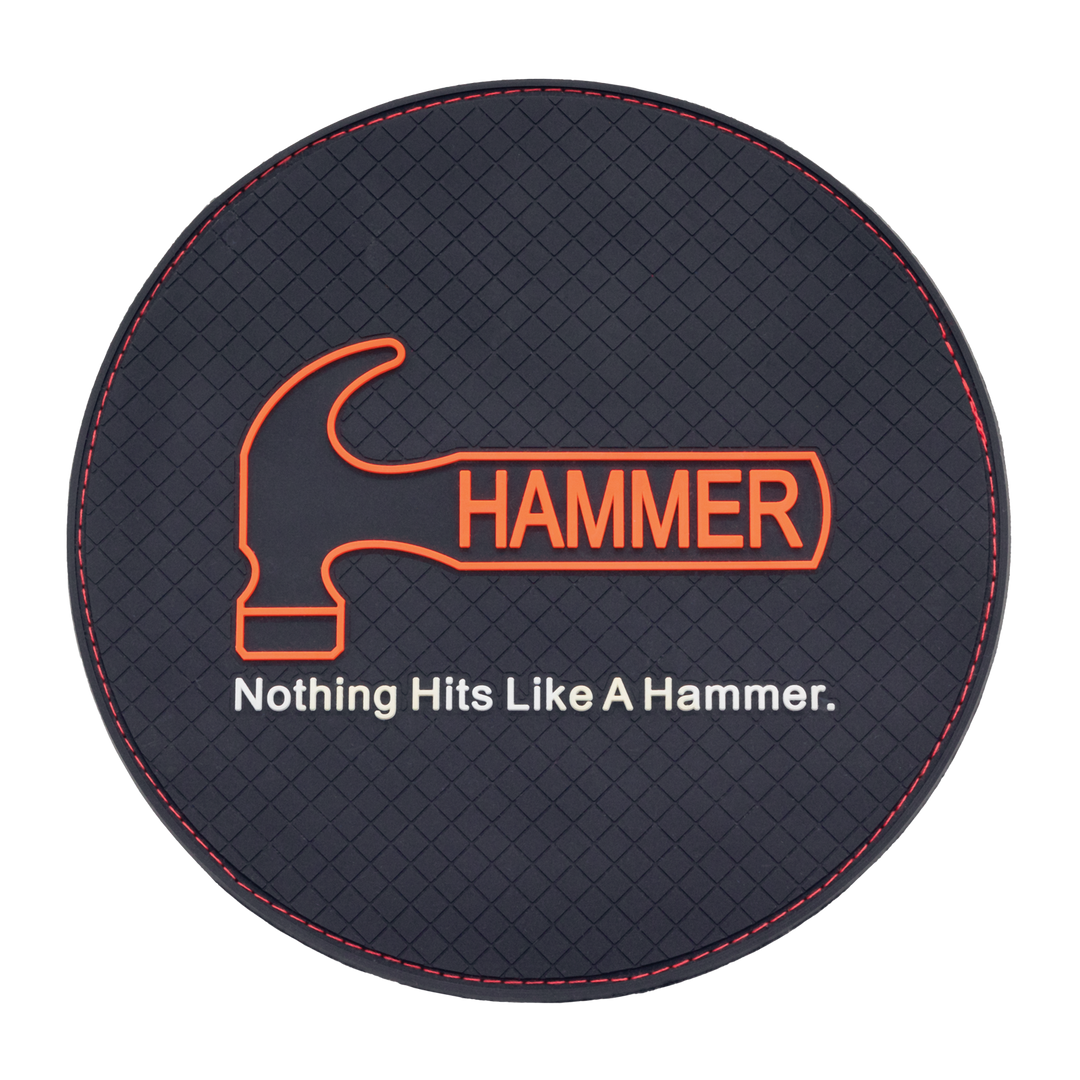 A round shammy pad with a black, rubber front with a diamond texture and the Hammer logo and tag line molded in the rubber.