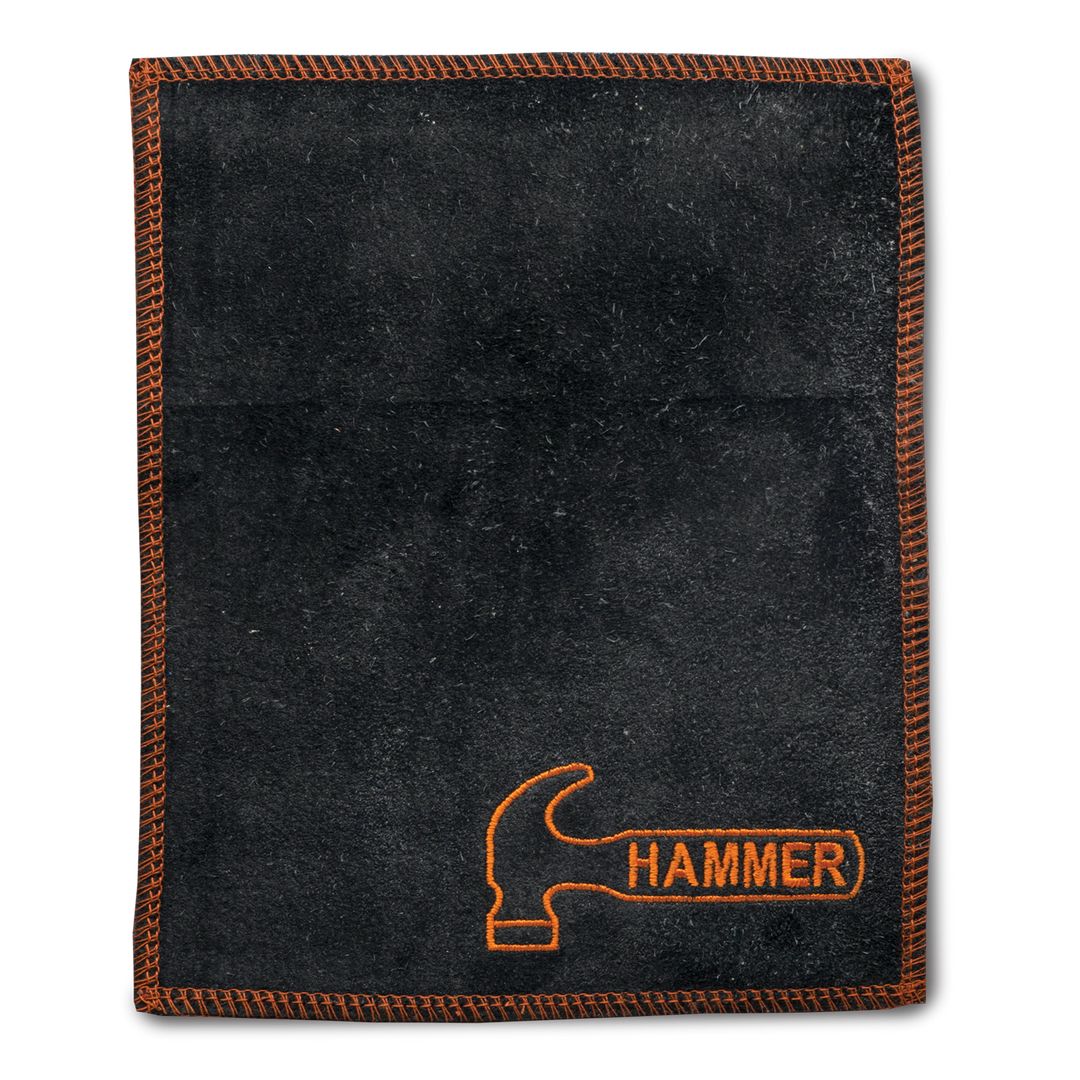 A black shammy pad with orange stitching around all edges and the Hammer logo embroidered in orange in the lower right corner.