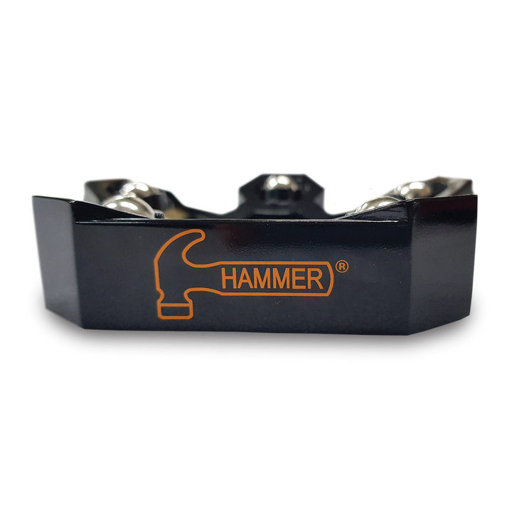 Looking straight-on at the side of a black rotating ball cup with the brand 'HAMMER' written in orange on the side.