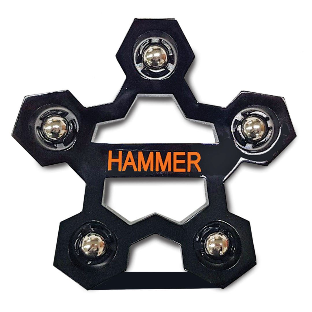 Looking straight down from the top of a black rotating ball cup with the brand 'HAMMER' written in orange on the central piece, surrounded by five silver ball bearings.