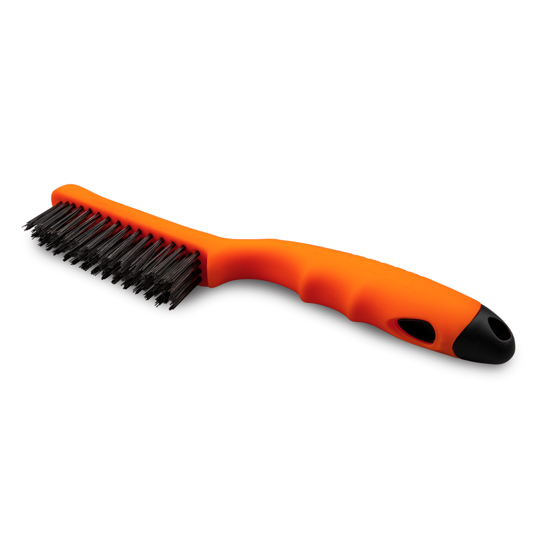 Shoe Brush with orange body and black bristles.