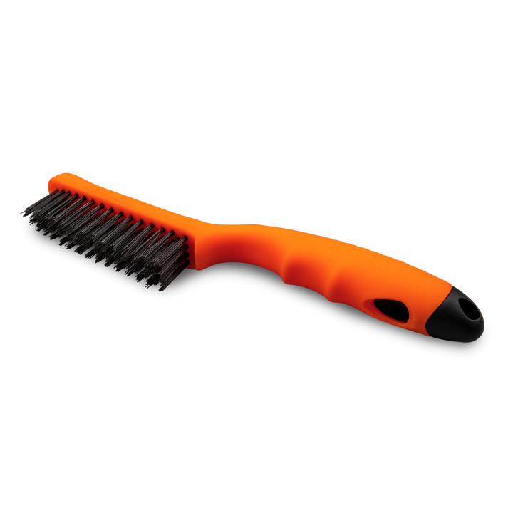 Shoe Brush with orange body and black bristles.