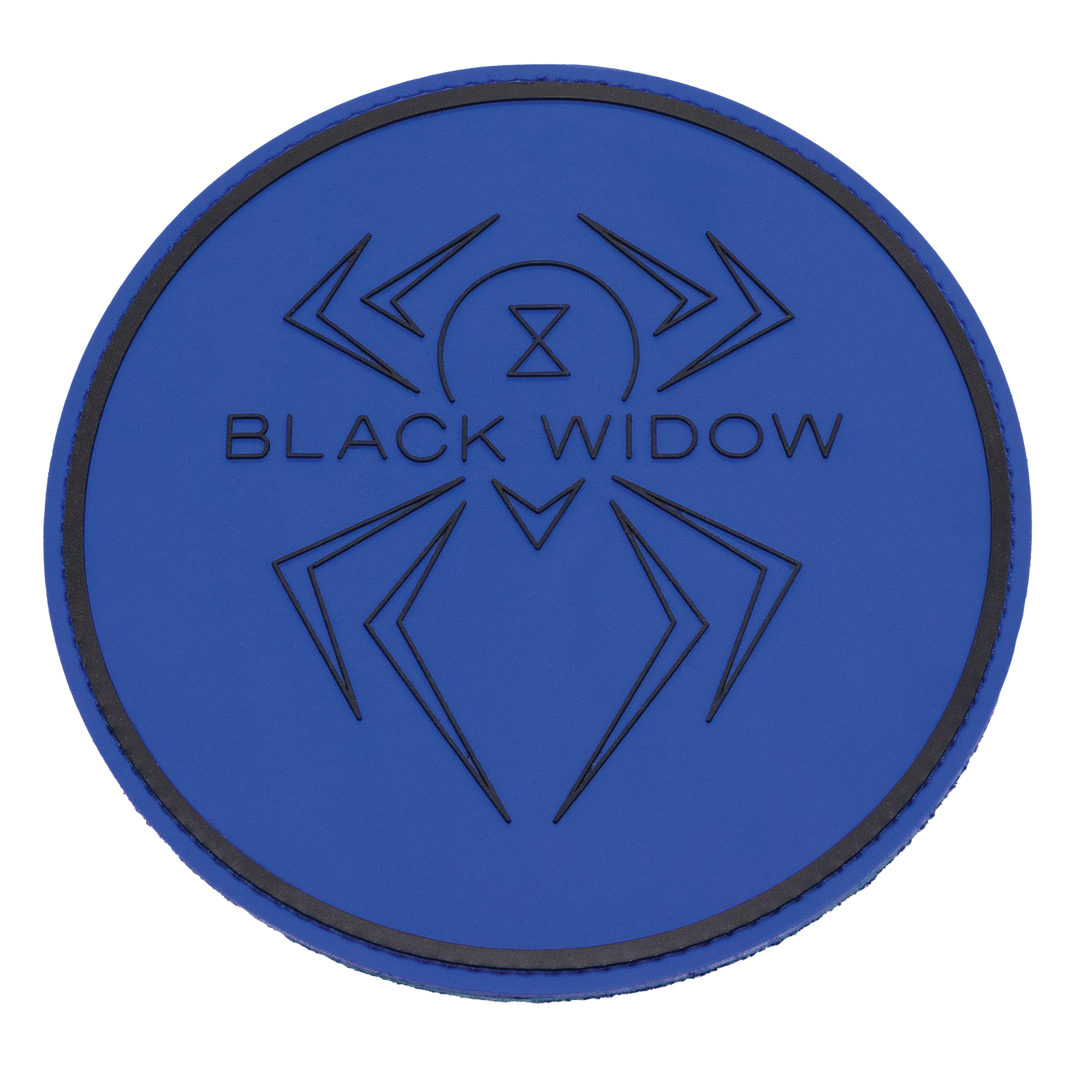A round shammy pad with a blue, rubber front with the Black Widow logo and a thicker line near the edge of the circle shape molded in black into the rubber.