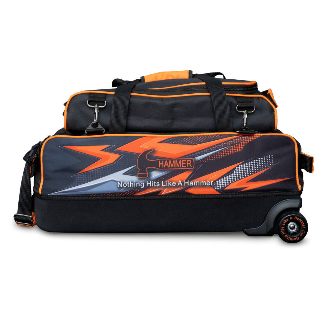The Hammer Dye-Sub Triple Tote with pouch on top with orange graphics printed on the side.