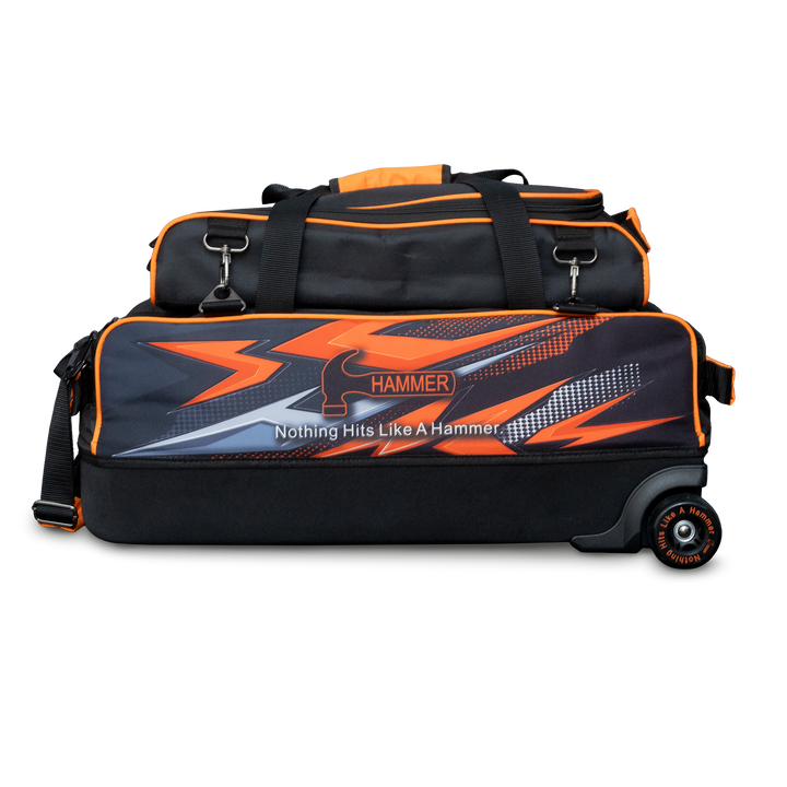 The Hammer Dye-Sub Triple Tote with pouch on top with orange graphics printed on the side.