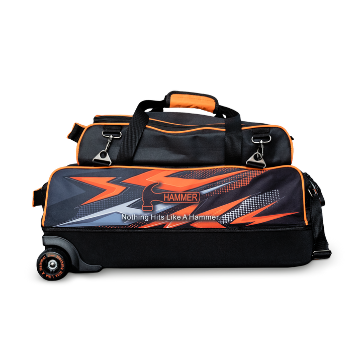 The Hammer Dye-Sub Triple Tote with pouch on top with orange graphics printed on the side.