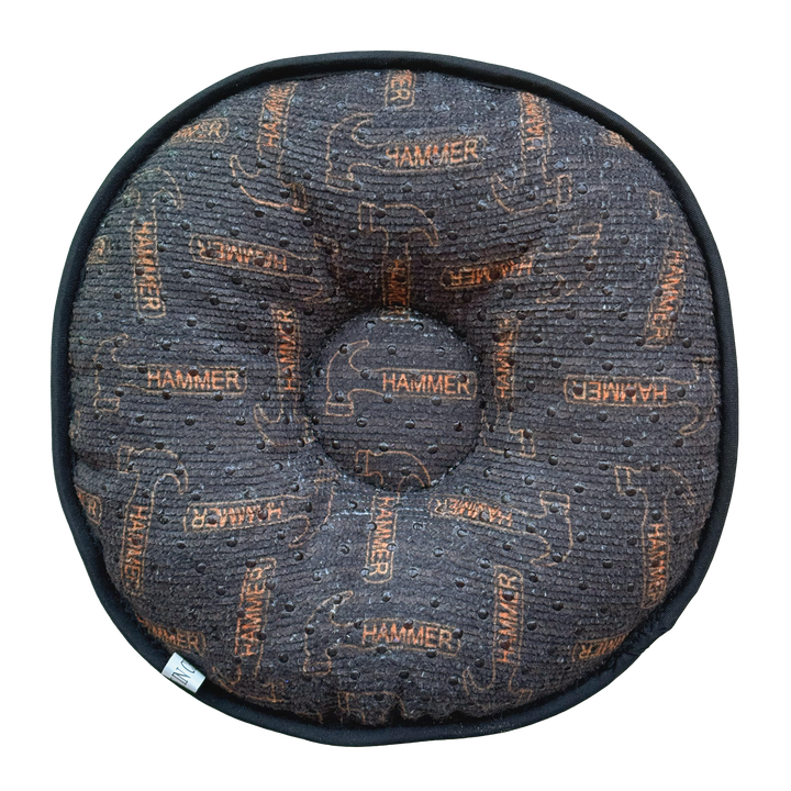 A round pillow-like shammy pad with a grey background and orange Hammer logos randomly placed throughout.