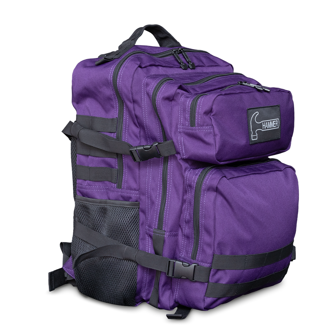 A purple backpack with black straps and the Hammer logo in white in a three-quarter front view facing right.
