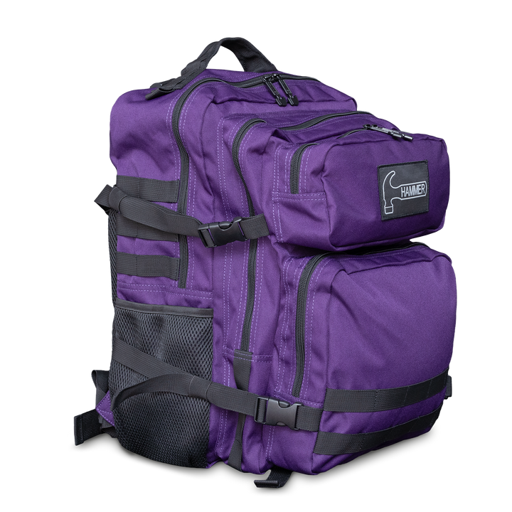 A purple backpack with black straps and the Hammer logo in white in a three-quarter front view facing right.