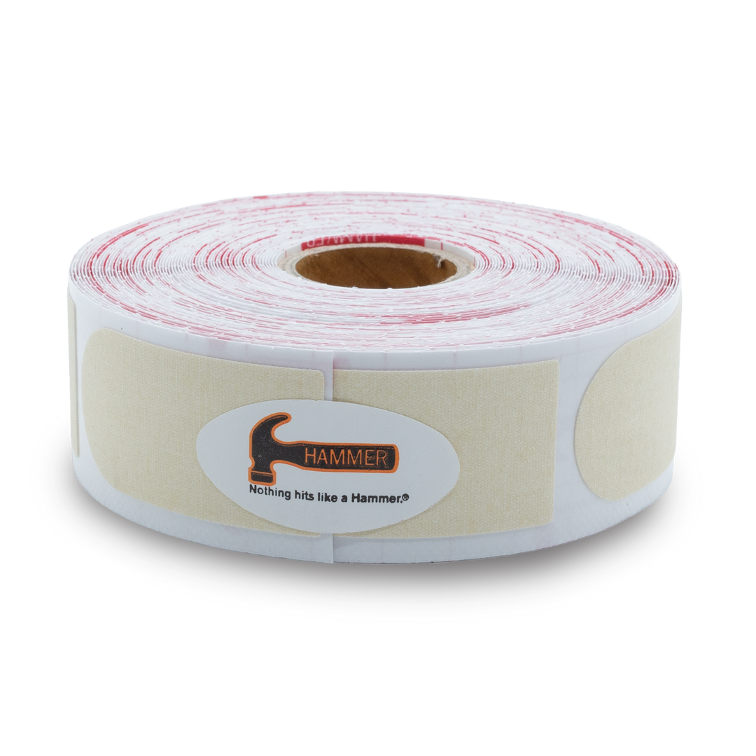 A roll of cream colored Insert Tape pieces.