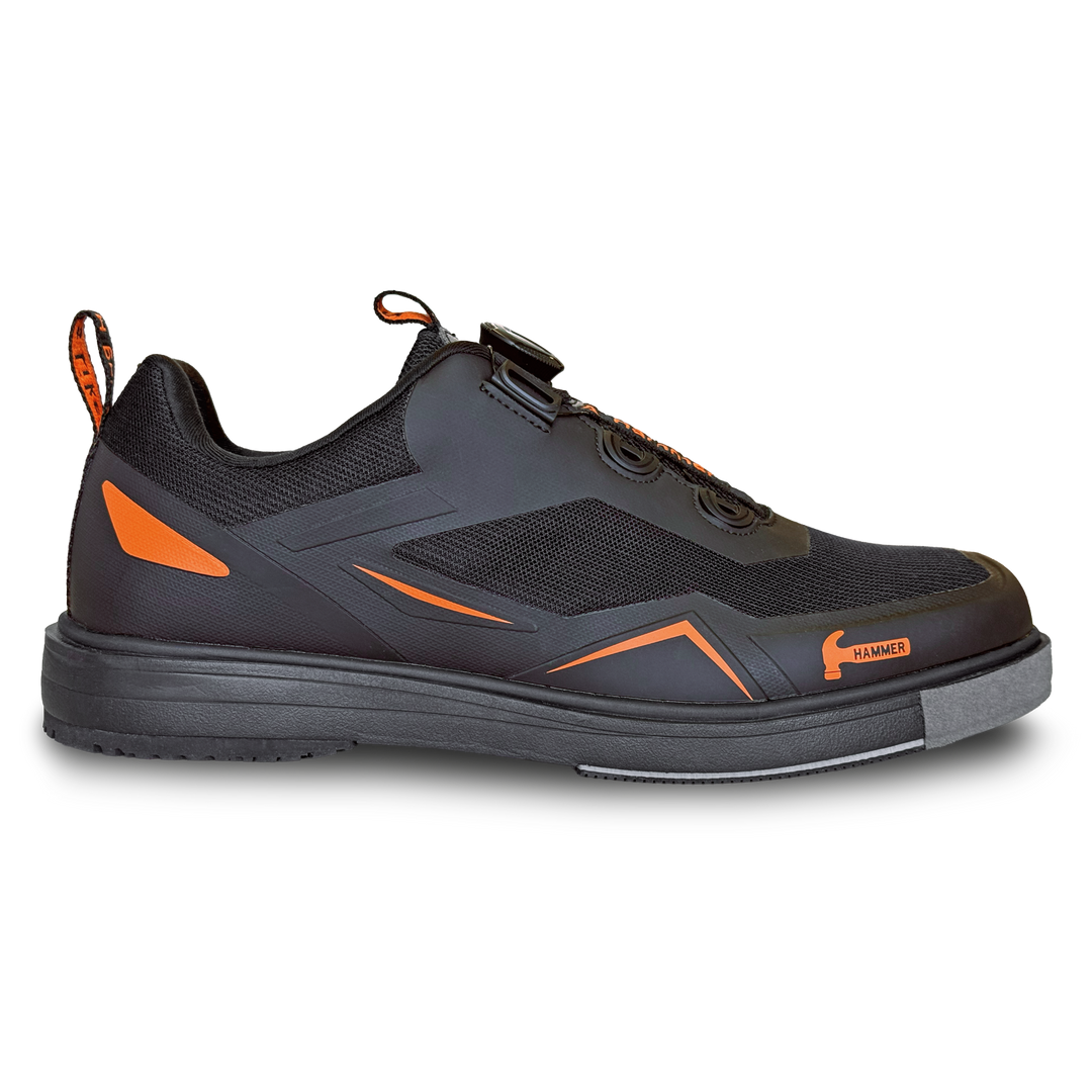 A black shoe with orange accents in a side profile view.